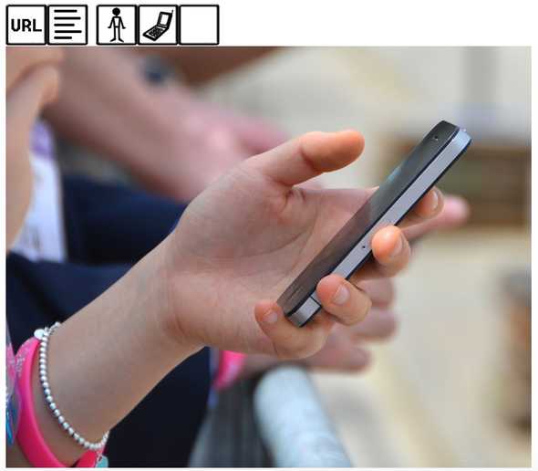Original picture of person holding mobile phone.